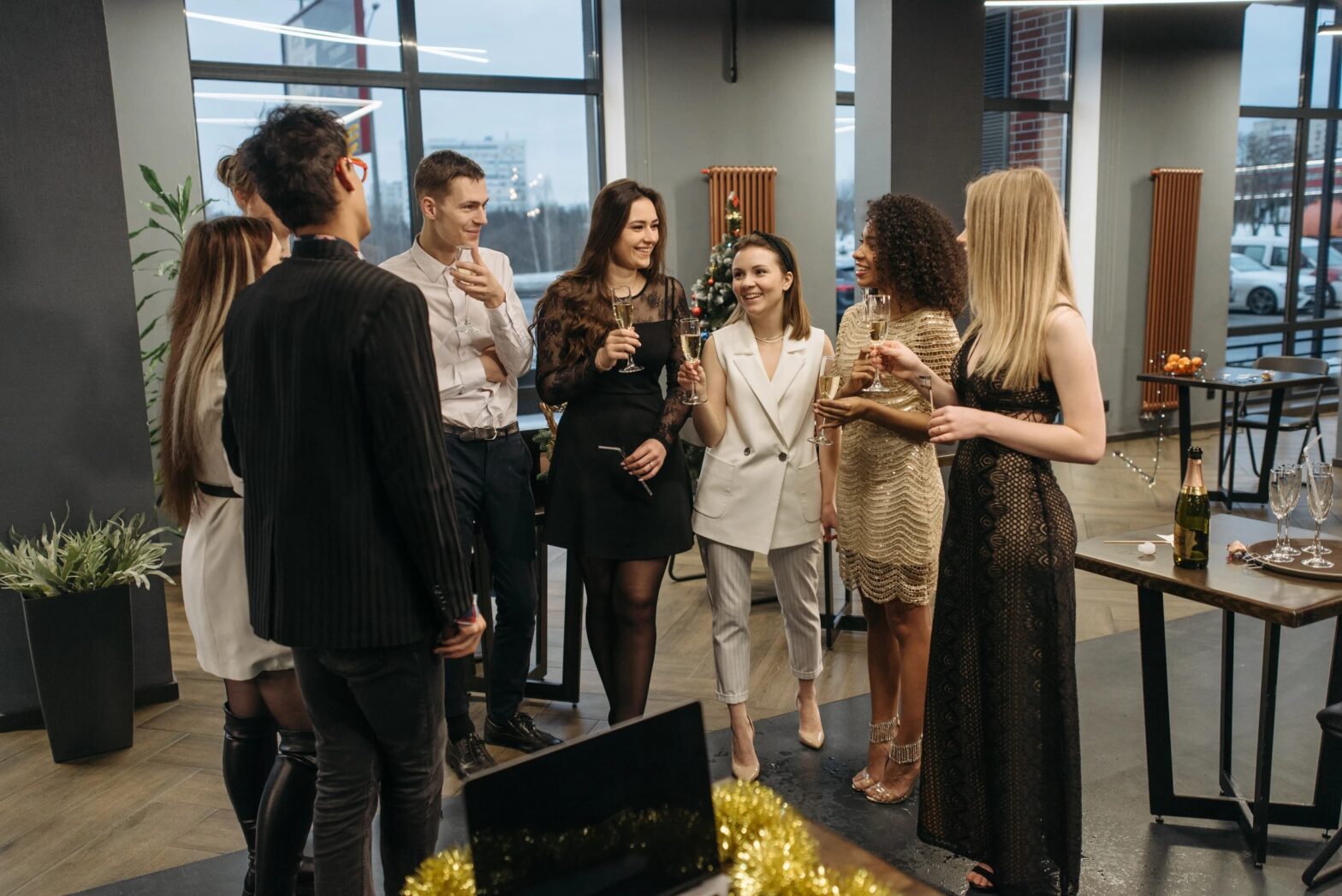 A group of people standing around a table.