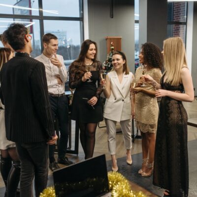 A group of people standing around a table.