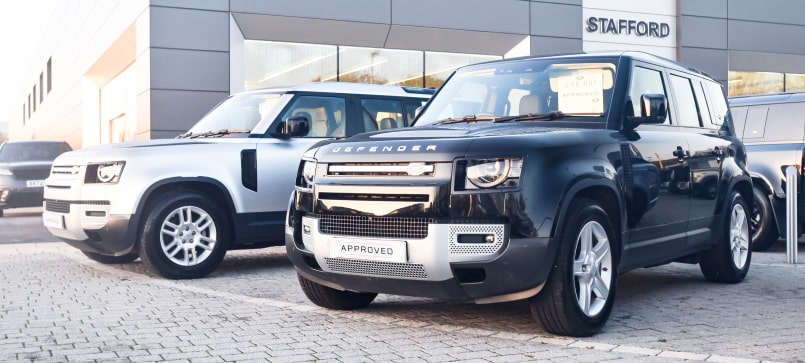 Vehicles at a dealership.